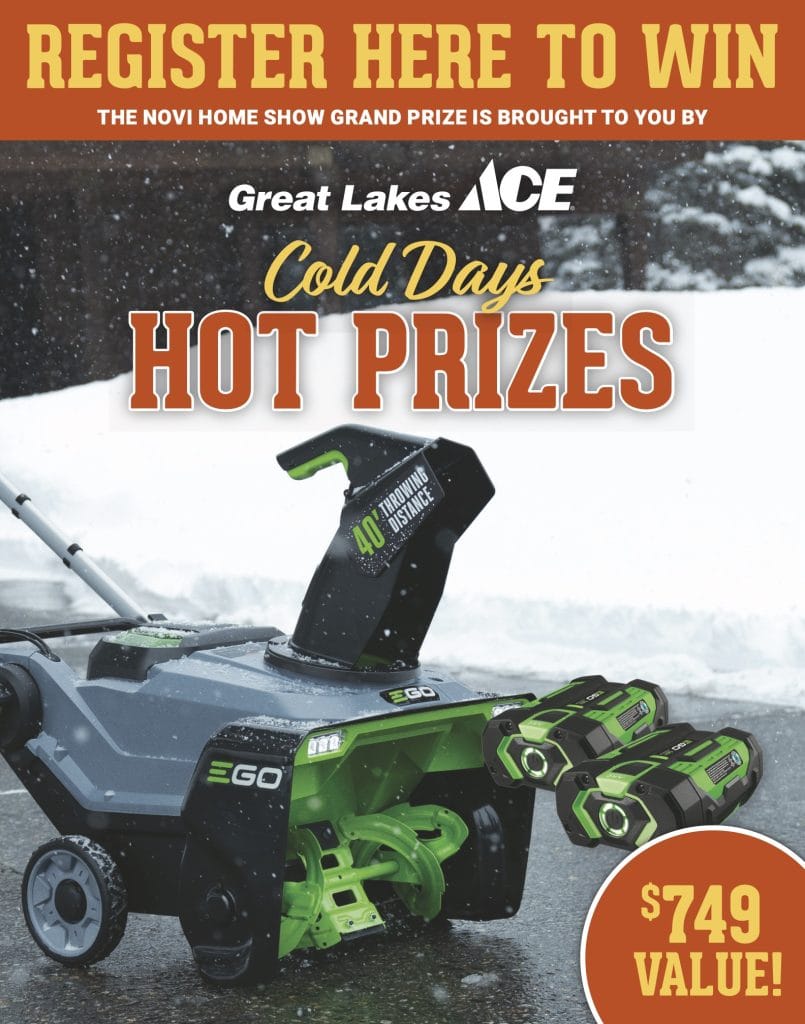 GLA_Novi Home Show_Fall25_Prizes 22x28-2 A green and black snow blower with two batteries on a snowy driveway; text promotes a contest to win a $749 value prize from Great Lakes Ace.